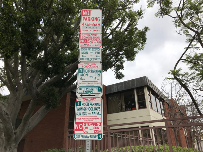 Long row of confusing parking signs in Culver City, CA.